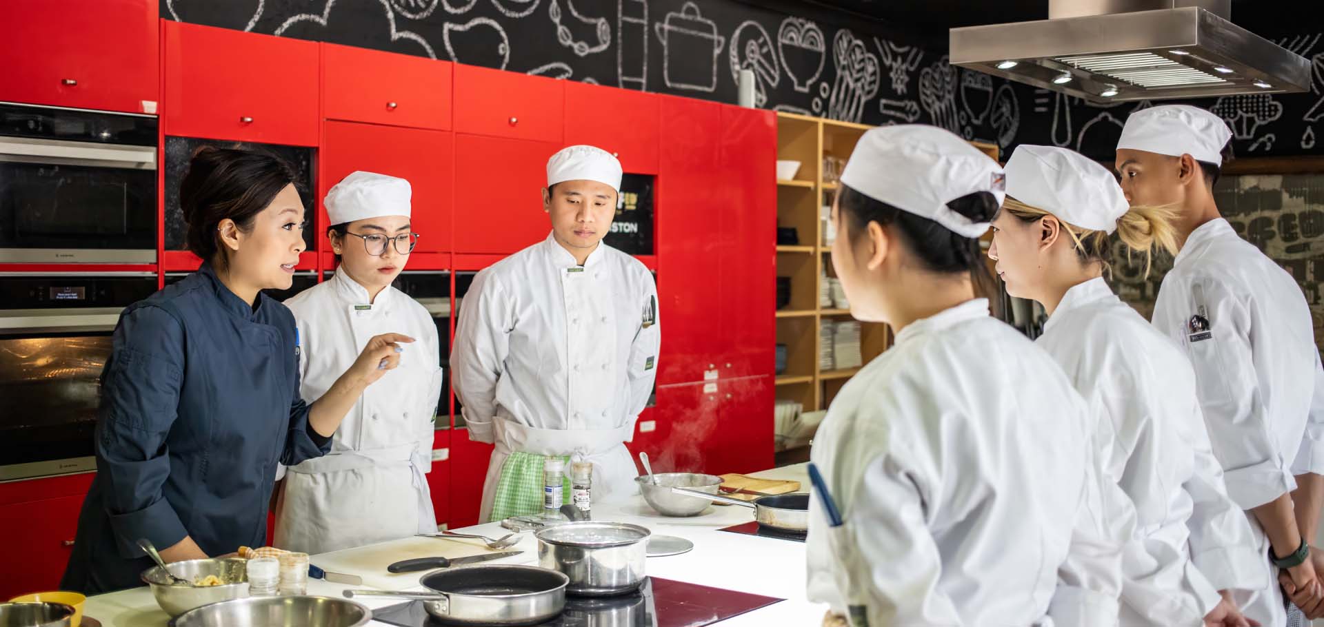 Students in practical kitchen environment