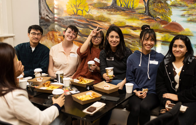 Students meeting new friends during a StudyAdelaide coffee connect event