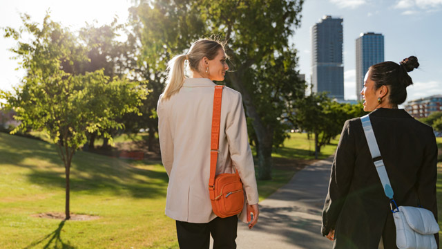 Image of two students walking to work